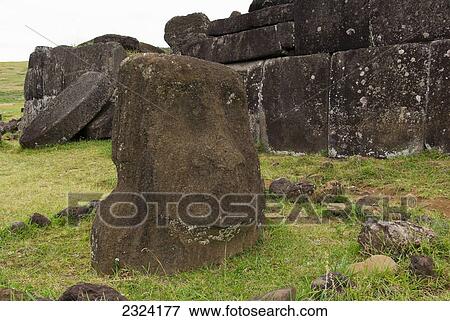 Ahu Vinapu, an ancient tiki in front of Inca type massive stone wall; Easter Island, Chile View Large Photo Image Stock Photo - Ahu Vinapu, an ancient tiki in front of Inca type massive stone wall; Easter Island, Chile. Fotosearch