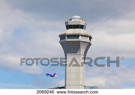 Air Traffic Control Tower And A Plane In Flight At Portland International Airport; Portland Oregon United States Of America View Large Photo Image Stock Photograph - Air Traffic Control Tower And A Plane In Flight At Portland International Airport; Portland Oregon United States Of America. Fotosearch