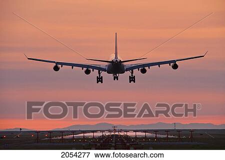 Stock Photo - Airbus 340 Landing At Vancouver International Airport; Vancouver, British Columbia, Canada. Fotosearch