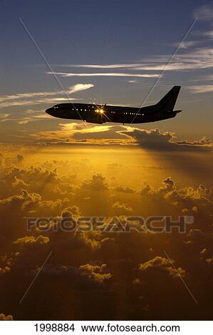 Picture - Airplane In Silhouette, Sun Through Window In Sky, Sunset B1177. Fotosearch