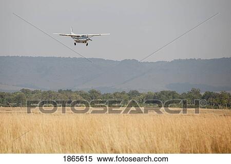 Airplane Over Field, Kenya, Africa View Large Photo Image Stock Photography - Airplane Over Field, Kenya, Africa. Fotosearch