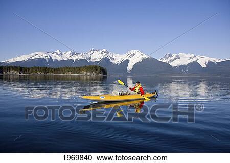 Stock Image - Alaska, Juneau, Favorite Passage. Kayaking Through Beautiful Mountain Ranges.. Fotosearch