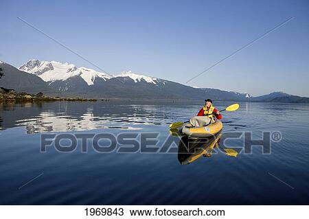 Alaska, Juneau, Favorite Passage. Kayaking Through Beautiful Mountain Ranges. View Large Photo Image Stock Image - Alaska, Juneau, Favorite Passage. Kayaking Through Beautiful Mountain Ranges.. Fotosearch