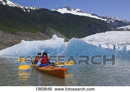 Alaska, Juneau, Favorite Passage. Kayaking Through Beautiful Mountain Ranges. View Large Photo Image Stock Photograph - Alaska, Juneau, Favorite Passage. Kayaking Through Beautiful Mountain Ranges.. Fotosearch