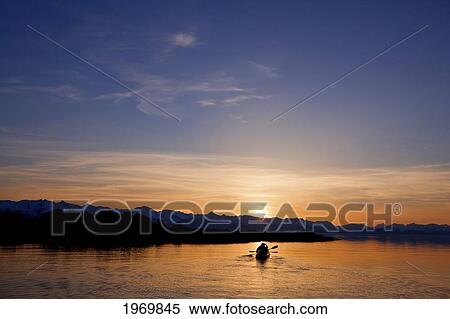 Stock Photography - Alaska, Juneau, Favorite Passage. Kayaking Through Beautiful Mountain Ranges As The Sunsets.. Fotosearch