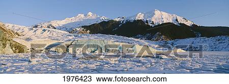 Stock Image - Alaska, Juneau, Mendenhall Glacier, Mount Mcginnis And Mount Stroller White In Background.. Fotosearch