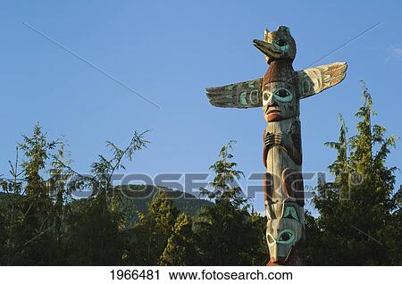 Stock Image - Alaska, Ketchikan, Saxman Totem Park, Top Of Tlingit Totem Pole.. Fotosearch