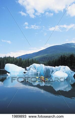Alaska, Tongass National Forest, Tracy Arms Terror Wilderness, Kayaker Passing Through Icebergs. View Large Photo Image Stock Image - Alaska, Tongass National Forest, Tracy Arms Terror Wilderness, Kayaker Passing Through Icebergs.. Fotosearch