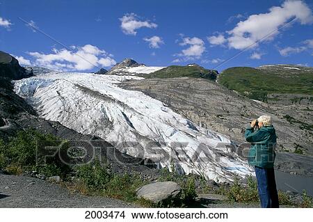 Alaska, Worthington Glacier, Senior Woman Enjoying Beauty With Binoculars View Large Photo Image Picture - Alaska, Worthington Glacier, Senior Woman Enjoying Beauty With Binoculars. Fotosearch