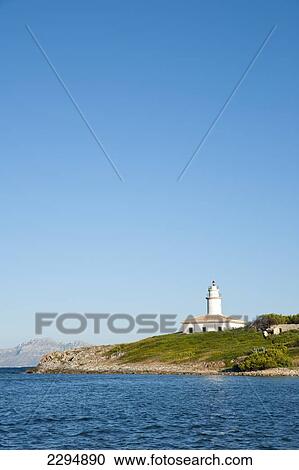 Stock Image - Alcanada Island And Its Lighthouse Near Alcudia, Mallorca, Balearic Islands, Spain. Fotosearch