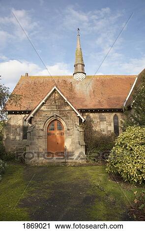 Stock Image - Alnmouth, Northumberland, England; The Entrance To A Stone Building With A Spire. Fotosearch