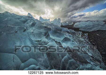 Along the south shore of Iceland, large chunks of ice litter the beach after being washed out to sea from the Jokulsarlon lagoon; Iceland View Large Photo Image Stock Photography - Along the south shore of Iceland, large chunks of ice litter the beach after being washed out to sea from the Jokulsarlon lagoon; Iceland. Fotosearch