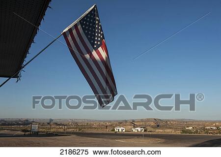Stock Photography - American Flag At Big Bend Resort And Adventures Hotel, Route 118 At Route 170, Terlingua, Big Bend, Texas, Usa. Fotosearch
