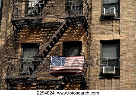 Picture - American Flag Outside An Apartments Building In Chelsea, Manhattan, New York, Usa. Fotosearch