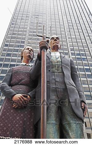 American Gothic Statue And A Skyscraper; Chicago Illinois United States Of America View Large Photo Image Stock Photo - American Gothic Statue And A Skyscraper; Chicago Illinois United States Of America. Fotosearch