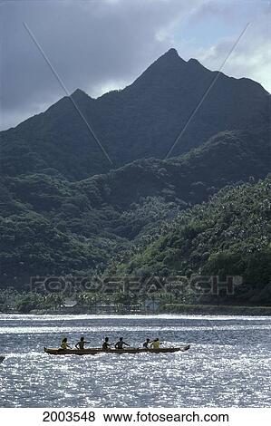American Samoa, Tutuila, View From Ocean Looking To Coastline, Mountain And Village, Canoe Paddlers In Shimmery Ocean View Large Photo Image Stock Photo - American Samoa, Tutuila, View From Ocean Looking To Coastline, Mountain And Village, Canoe Paddlers In Shimmery Ocean. Fotosearch