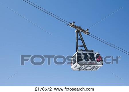 Stock Image - An Aerial Tramway In The Blue Sky; Chaminox-Mont-Blanc Rhone-Alpes France. Fotosearch