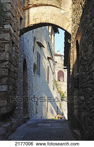 An Alley Between Buildings; San Gimignano Italy View Large Photo Image Stock Photograph - An Alley Between Buildings; San Gimignano Italy. Fotosearch