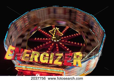 Stock Photograph - An Amusement Park Ride Called Energizer Illuminated At Night; South Shields Tyne And Wear England. Fotosearch