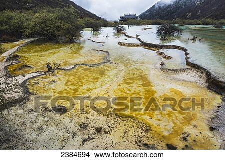 An ancient Tibetan Buddhist temple in a green valley with colourful ponds and brooks; Huanglong, Sichuan province, China View Large Photo Image Picture - An ancient Tibetan Buddhist temple in a green valley with colourful ponds and brooks; Huanglong, Sichuan province, China. Fotosearch