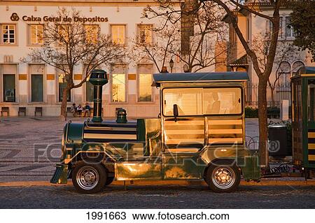 Stock Image - An Antique Car Parked On The Street; Faro Algarve Portugal. Fotosearch