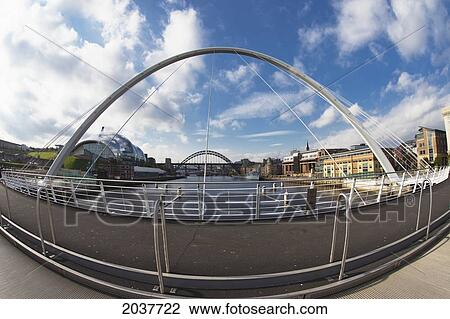 Stock Image - An Arch On A Pedestrian Bridge Going Over The River Tyne; Newcastle Northumberland England. Fotosearch