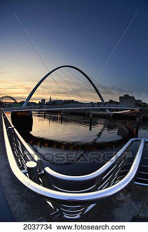 Picture - An Arched Bridge Crossing River Tyne And Sunset; Newcastle Tyne And Wear England. Fotosearch