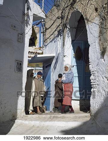 Stock Photograph - An Archqay With A Local Family. Fotosearch