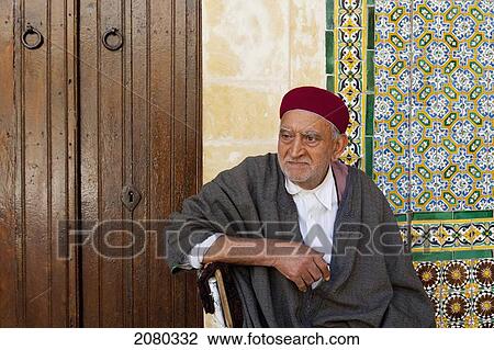 An Attendant Inside The Barber's Mosque Reputed To Have Three Hairs Of Mohammed's Beard; Kairouan, Tunisia, North Africa View Large Photo Image Stock Image - An Attendant Inside The Barber's Mosque Reputed To Have Three Hairs Of Mohammed's Beard; Kairouan, Tunisia, North Africa. Fotosearch