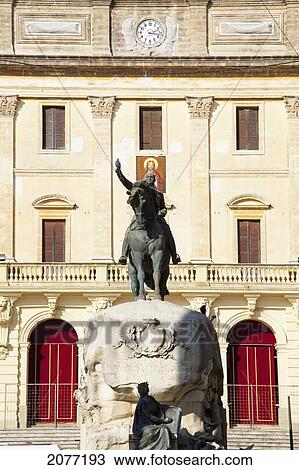 An Equestrian Statue With A Clock On A Building In The Background; San Fernando Andalusia Spain View Large Photo Image Stock Image - An Equestrian Statue With A Clock On A Building In The Background; San Fernando Andalusia Spain. Fotosearch