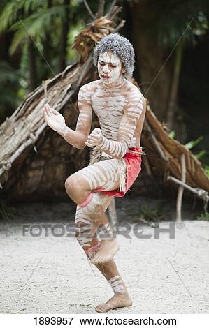 An Indigenous Man Dancing On The Sand; Queensland, Australia View Large Photo Image Stock Photo - An Indigenous Man Dancing On The Sand; Queensland, Australia. Fotosearch
