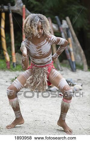 An Indigenous Man Dancing On The Sand; Queensland, Australia View Large Photo Image Stock Photo - An Indigenous Man Dancing On The Sand; Queensland, Australia. Fotosearch