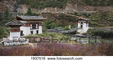 An Iron Suspension Bridge At Tamchhog Lhakhang Monastery Over The Paro Chhu River; Bhutan View Large Photo Image Stock Photograph - An Iron Suspension Bridge At Tamchhog Lhakhang Monastery Over The Paro Chhu River; Bhutan. Fotosearch