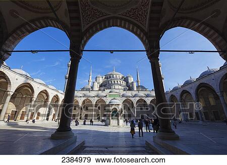 Stock Photo - An islam mosque viewed through arches and columns; Istanbul, Turkey. Fotosearch