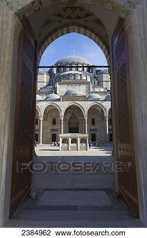 Stock Image - An islamic mosque view through an arched corridor; Istanbul, Turkey. Fotosearch