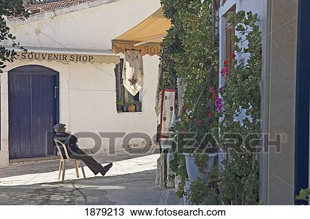An Old Man Sitting In A Shaded Street View Large Photo Image Stock Image - An Old Man Sitting In A Shaded Street. Fotosearch