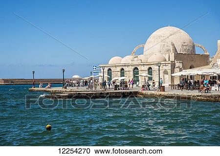 Stock Image - An old mosque in Venetian harbour; Chania, Crete, Greece. Fotosearch