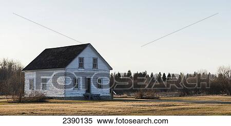 Stock Photography - An old white wooden house in Hecla-Grindstone Provincial Park; Manitoba, Canada. Fotosearch