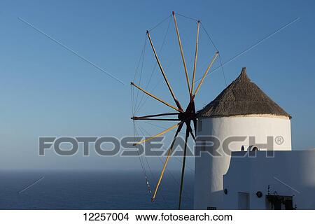 Picture - An old windmill overlooking the sea; Oia, Santorini, Cyclades, Greek Islands, Greece. Fotosearch