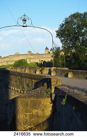Stock Photography - An ornate archway over a road; Cite, France. Fotosearch