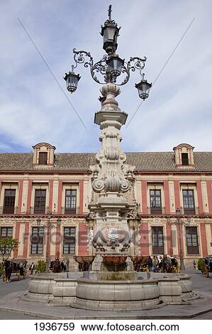 An Ornate Lamp Post In Front Of A Building; Sevilla Andalusia Spain View Large Photo Image Stock Photo - An Ornate Lamp Post In Front Of A Building; Sevilla Andalusia Spain. Fotosearch