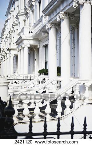 An ornate white building with railings and columns, Kensington; London, England View Large Photo Image Stock Image - An ornate white building with railings and columns, Kensington; London, England. Fotosearch