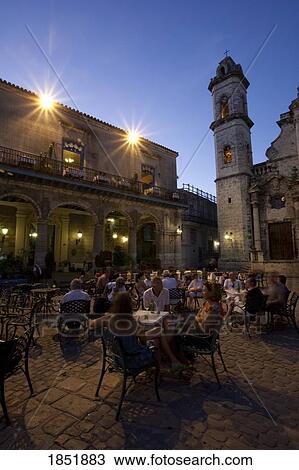Stock Image - An Outdoor Cafe At Night. Fotosearch