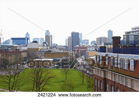 Picture - An urban park with skyscrapers in the distance, Shoreditch; London, England. Fotosearch