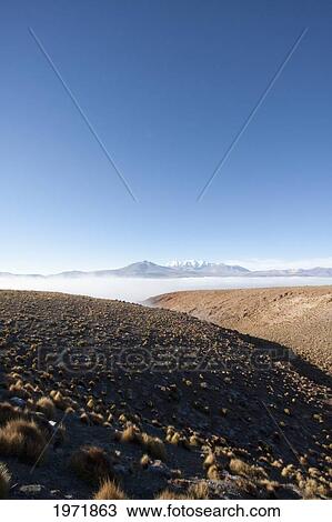 Andean Peaks & Salar De Alconcha Salt Pan Covered By Fog, Antofagasta Region, Chile View Large Photo Image Stock Image - Andean Peaks & Salar De Alconcha Salt Pan Covered By Fog, Antofagasta Region, Chile. Fotosearch