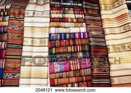 Stock Image - Andean Textiles For Sale At The Saturday Crafts Market, Otavalo, Imbabura, Ecuador. Fotosearch
