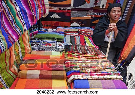 Stock Image - Andean Textiles For Sale At The Saturday Crafts Market, Otavalo, Imbabura, Ecuador. Fotosearch