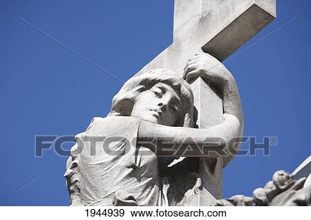 Stock Photo - Angel atop a mausoleum at the Cementerio de la Recoleta, Buenos Aires, Capital Federal, Argentina. Fotosearch