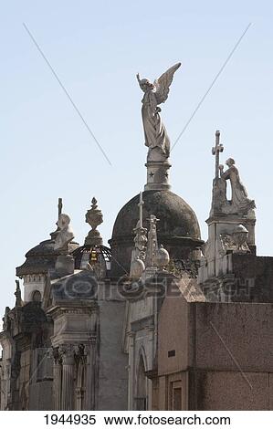 Stock Photography - Angel statue atop a mausoleum at the Cementerio de la Recoleta, Buenos Aires, Capital Federal, Argentina. Fotosearch