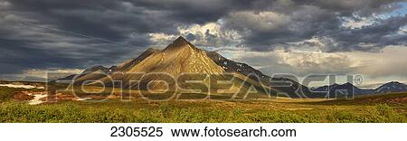 Stock Photography - Angelcomb Mountain Lit By Late Afternoon Light Along The Dempster Highway; Yukon Canada. Fotosearch